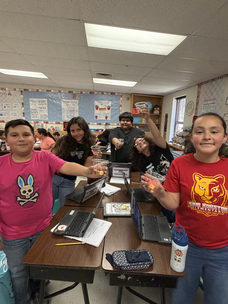 Students posing for science activity.