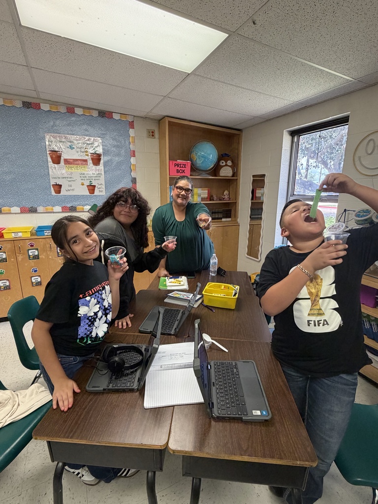 Students posing for science activity.