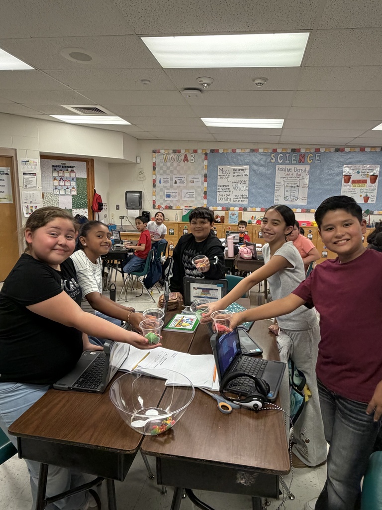 Students posing for science activity.