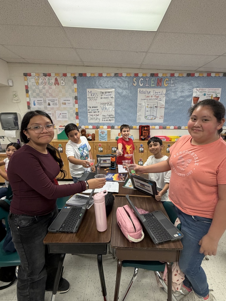 Students posing for science activity.