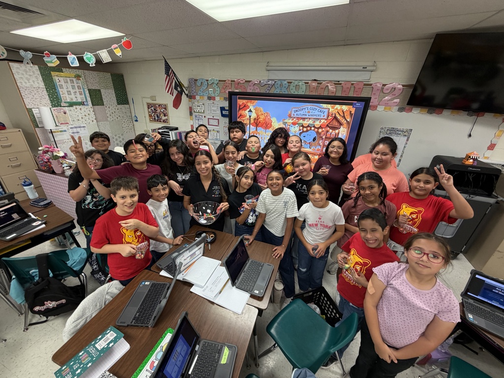 Students posing for science activity.