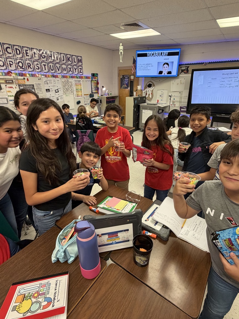 Kids posing during a science lesson.
