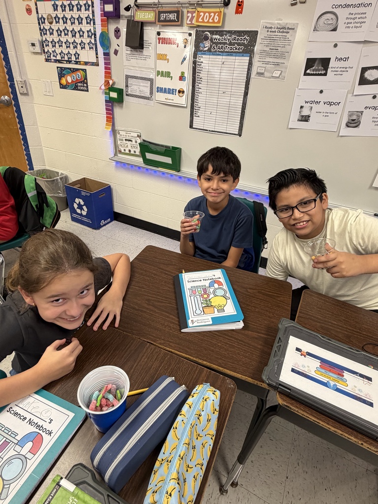 Kids posing during a science lesson.