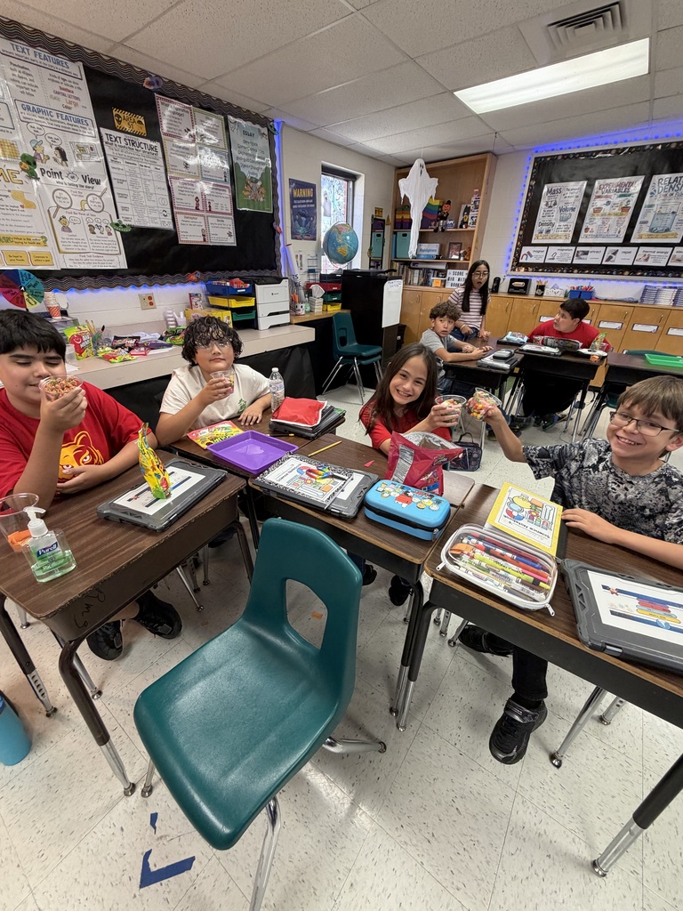 Kids posing during a science lesson.