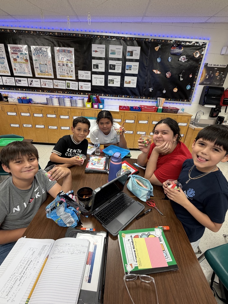 Kids posing during a science lesson.