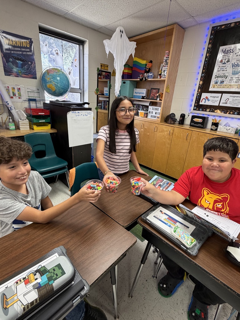 Kids posing during a science lesson.