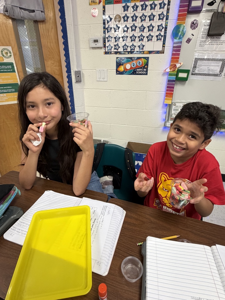 Kids posing during a science lesson.