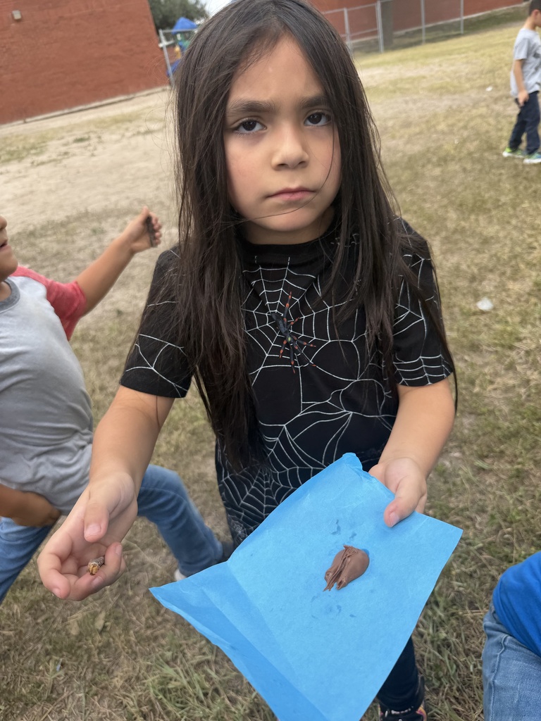 Students showing what happened to the chocolate.
