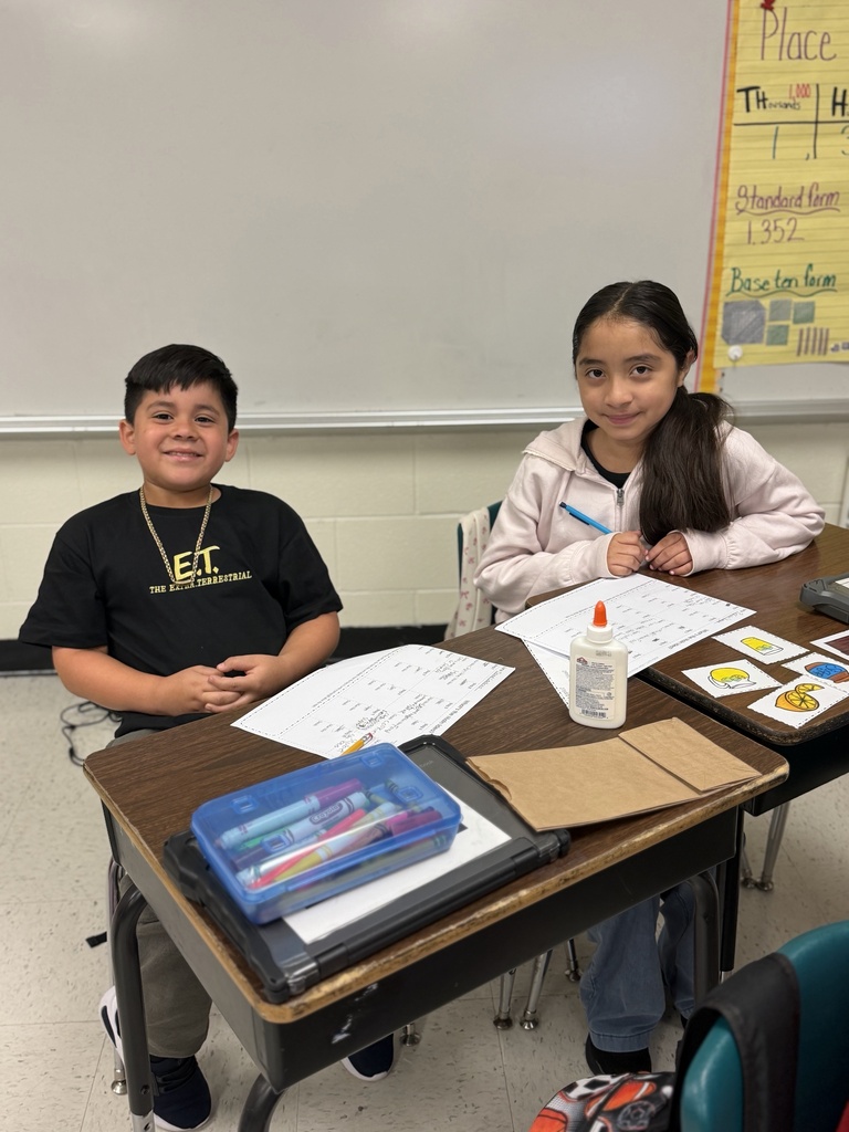 Students posing for main idea activity.