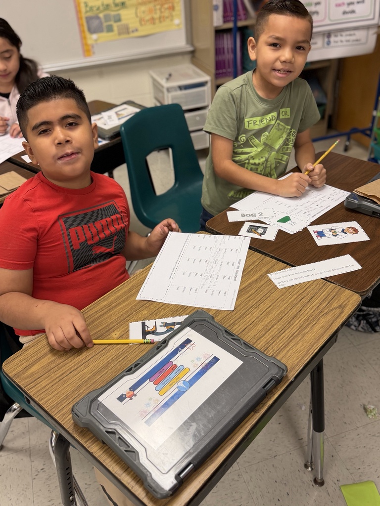 Students posing for main idea activity.