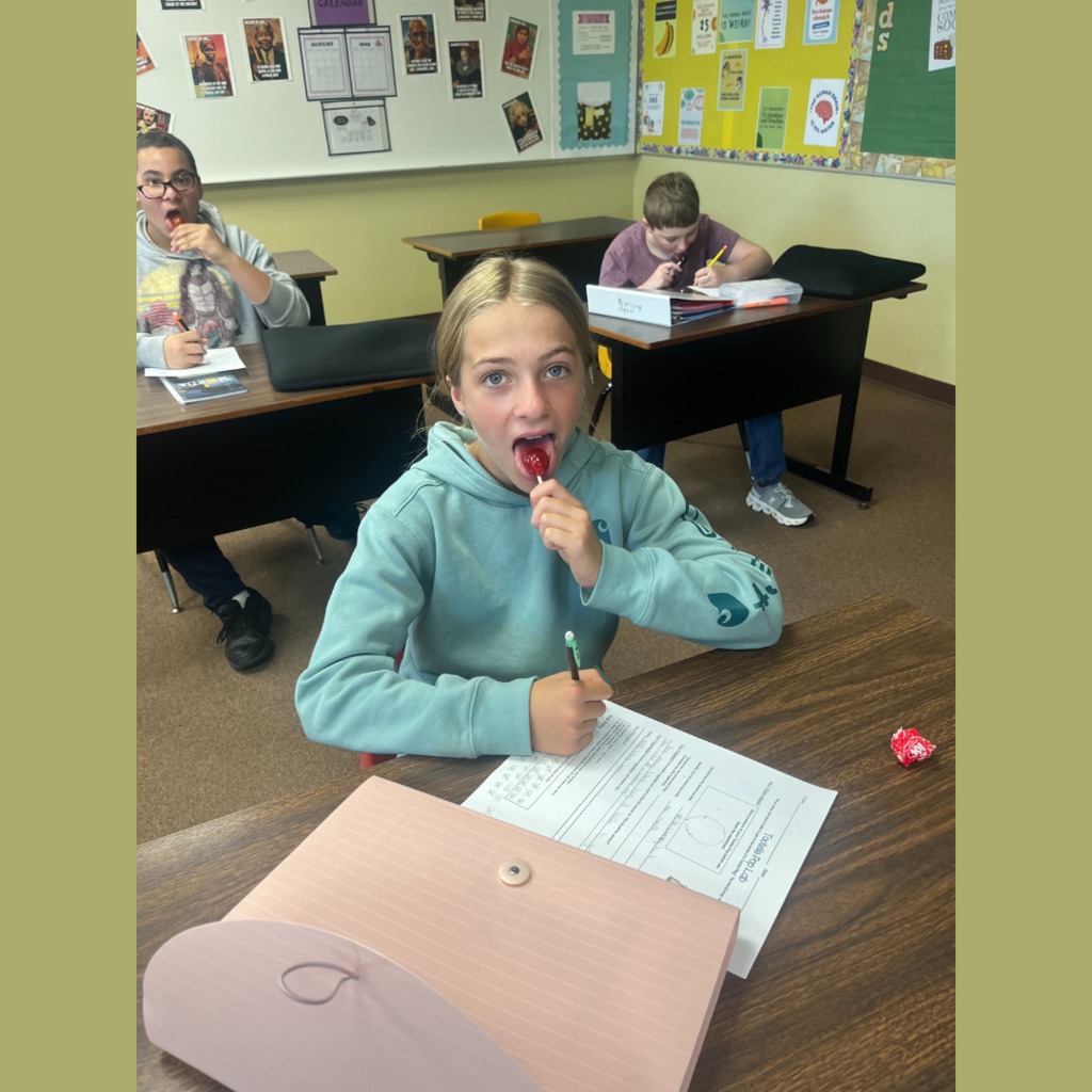 Junior high students eating Tootsie Pops