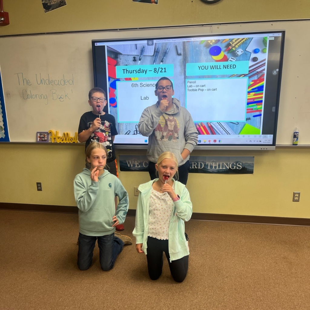 Junior high students eating Tootsie Pops