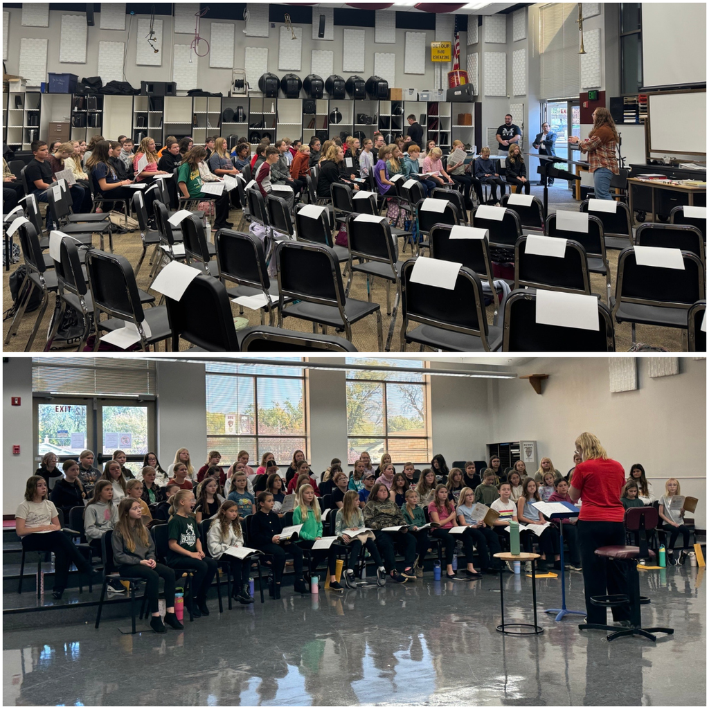 Junior high students listening to a conductor speak