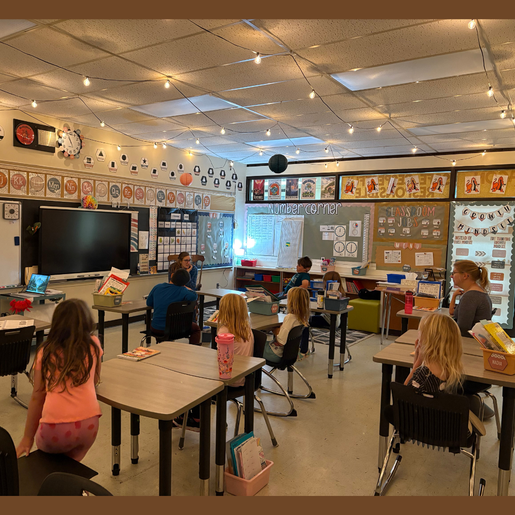 Lower elementary students listening to a nurse speak