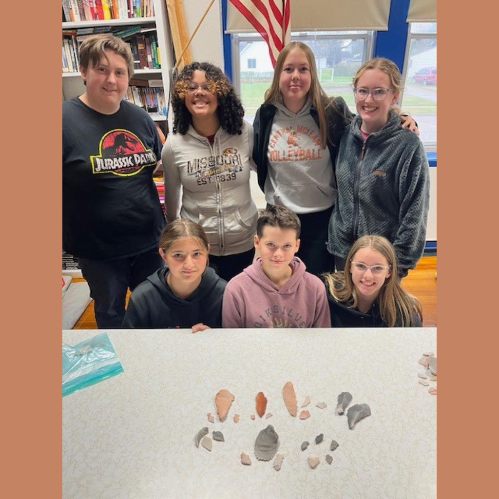 High school students posing with their flint knapped arrowheads