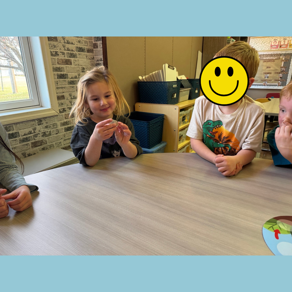 Kindergarten students learning about the life cycle of a frog