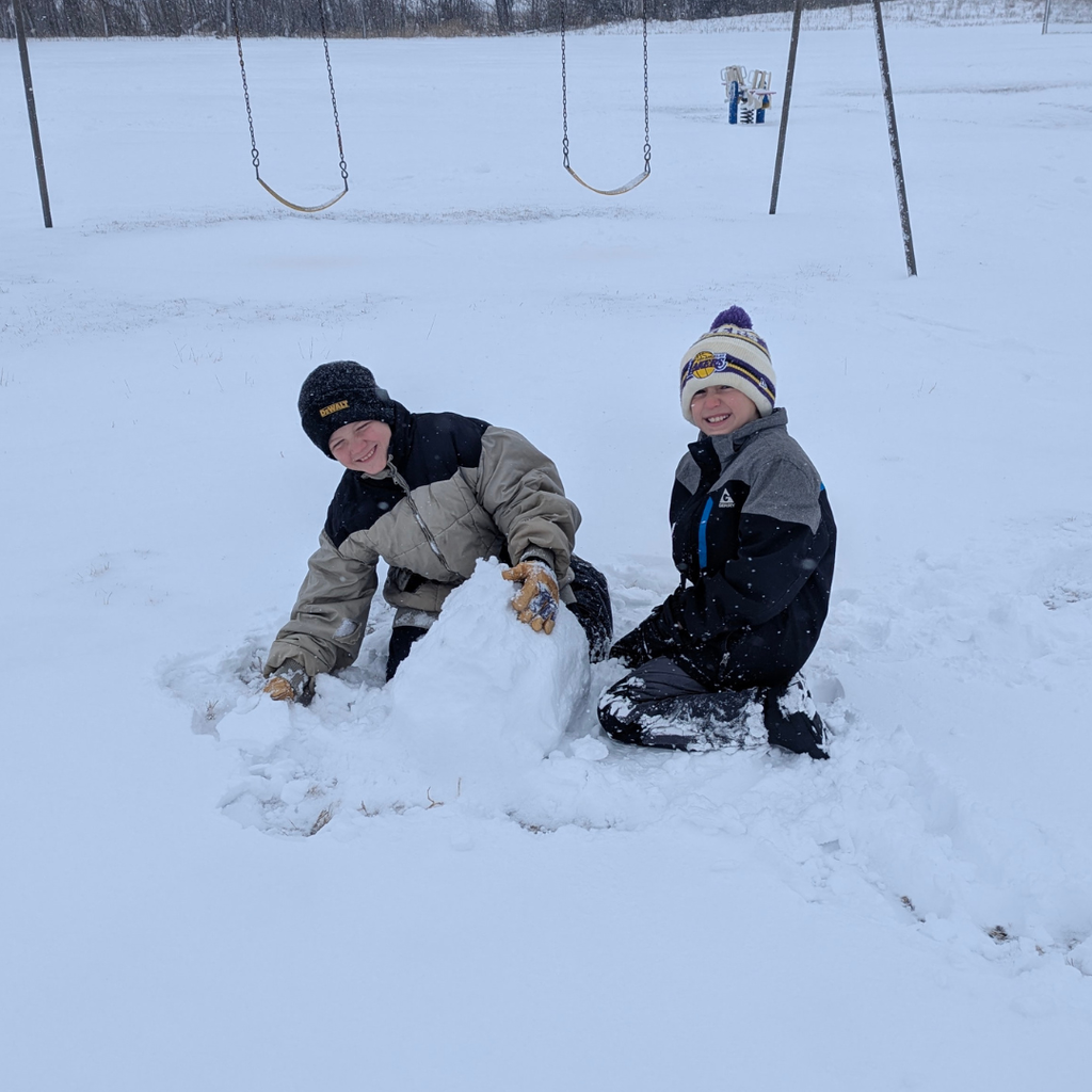 Elementary students playing in the newly fallen snow