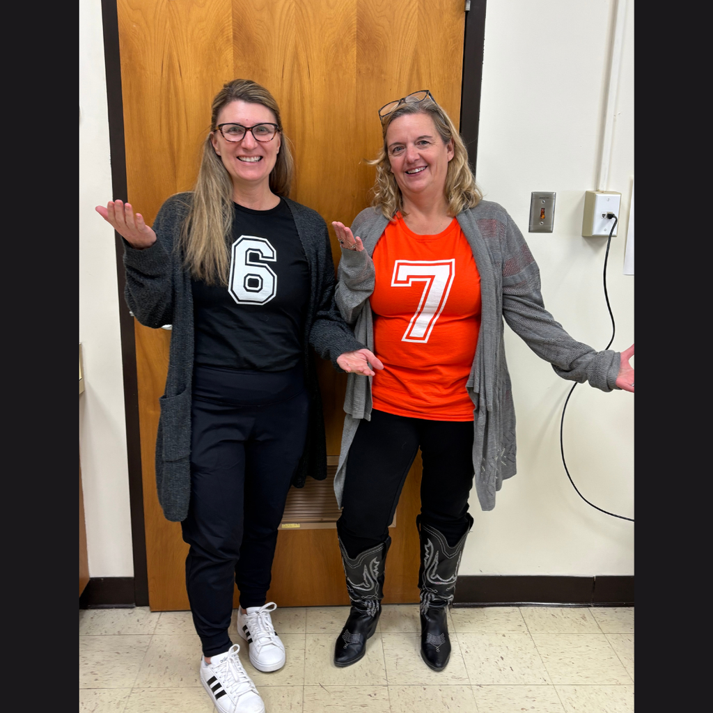 Two female administrators wearing shirts that say 6 and 7.
