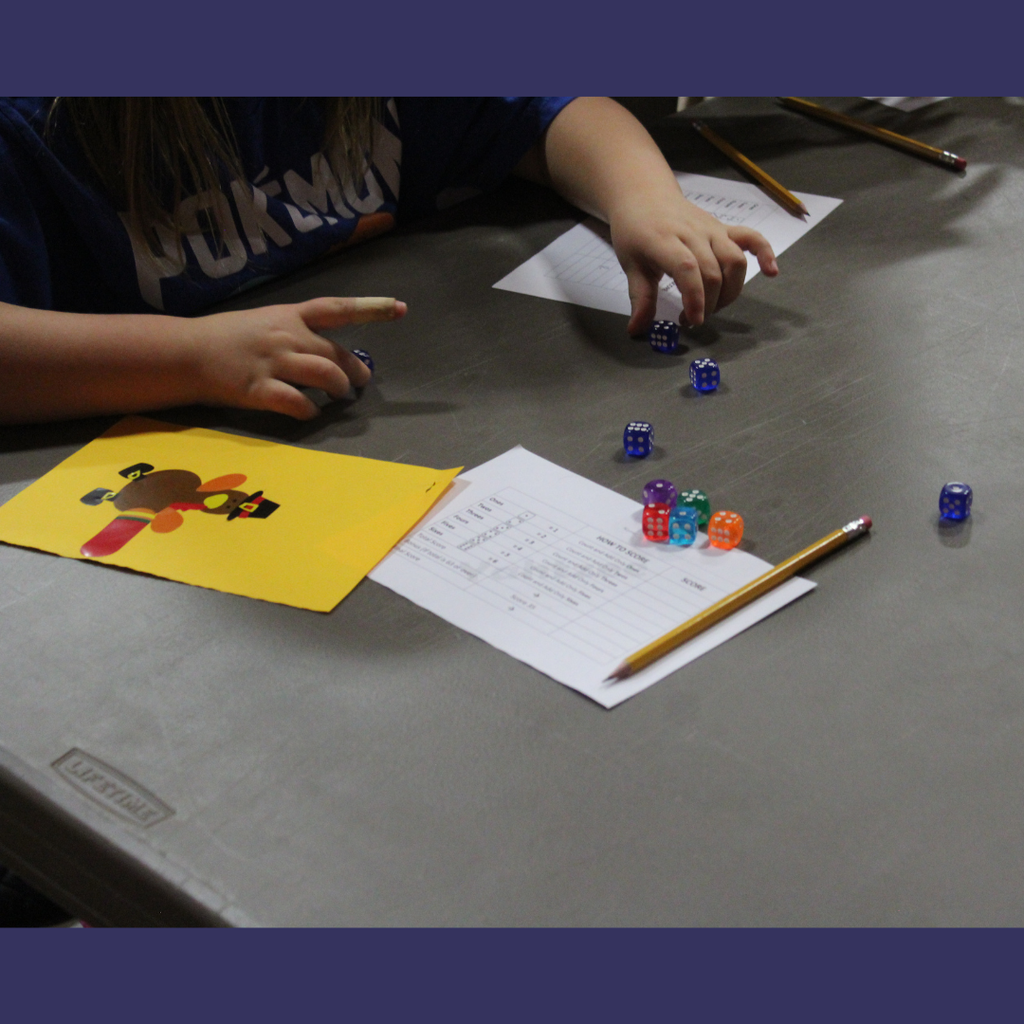 A small Yahtzee board with colorful dice
