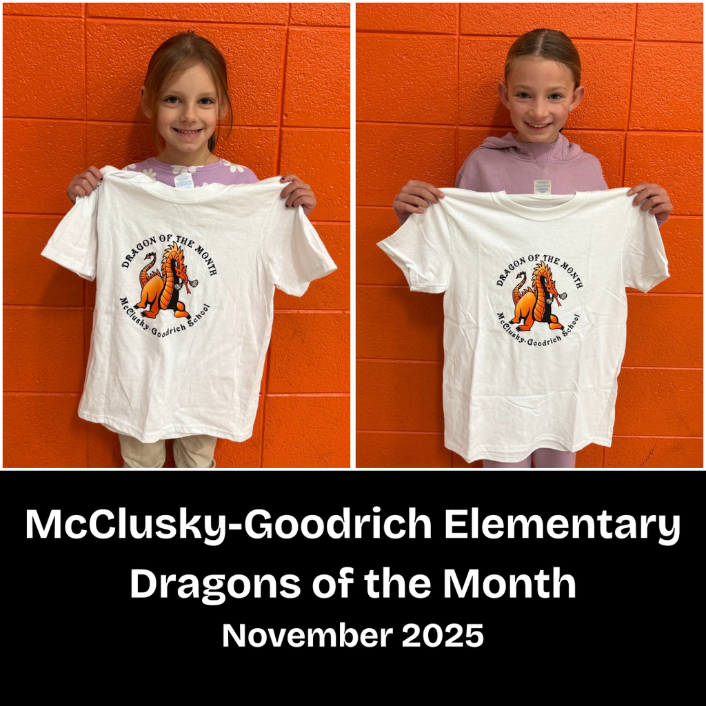 Two young elementary students posing with a Dragon of the Month T-shirt