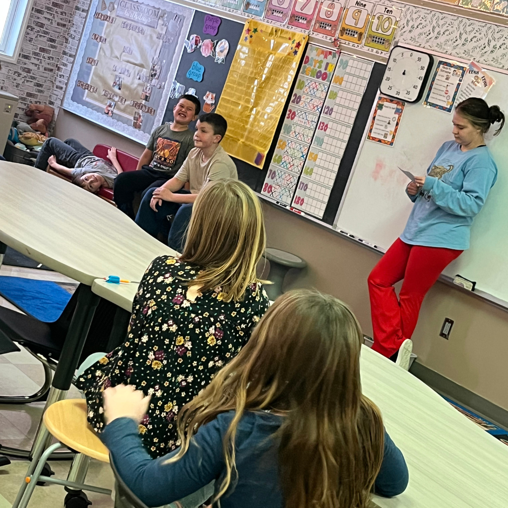 Elementary students sitting around a table