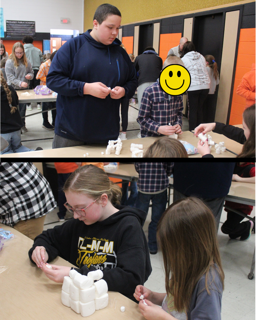 High school and elementary students building with marshmallows and toothpicks