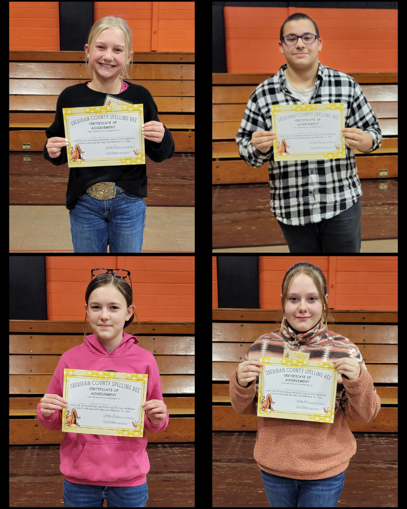 Junior high students holding certificates