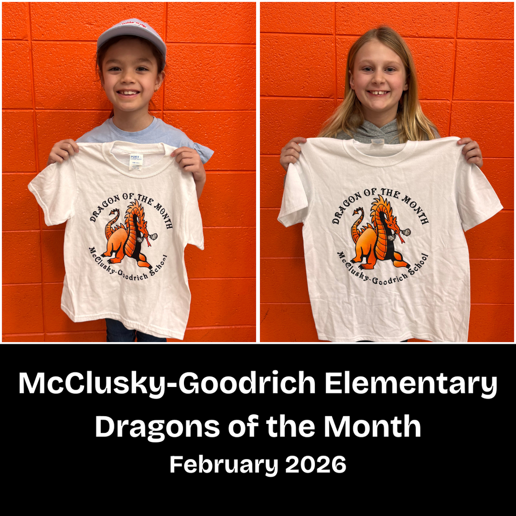 Two young elementary students posing with a Dragon of the Month T-shirt