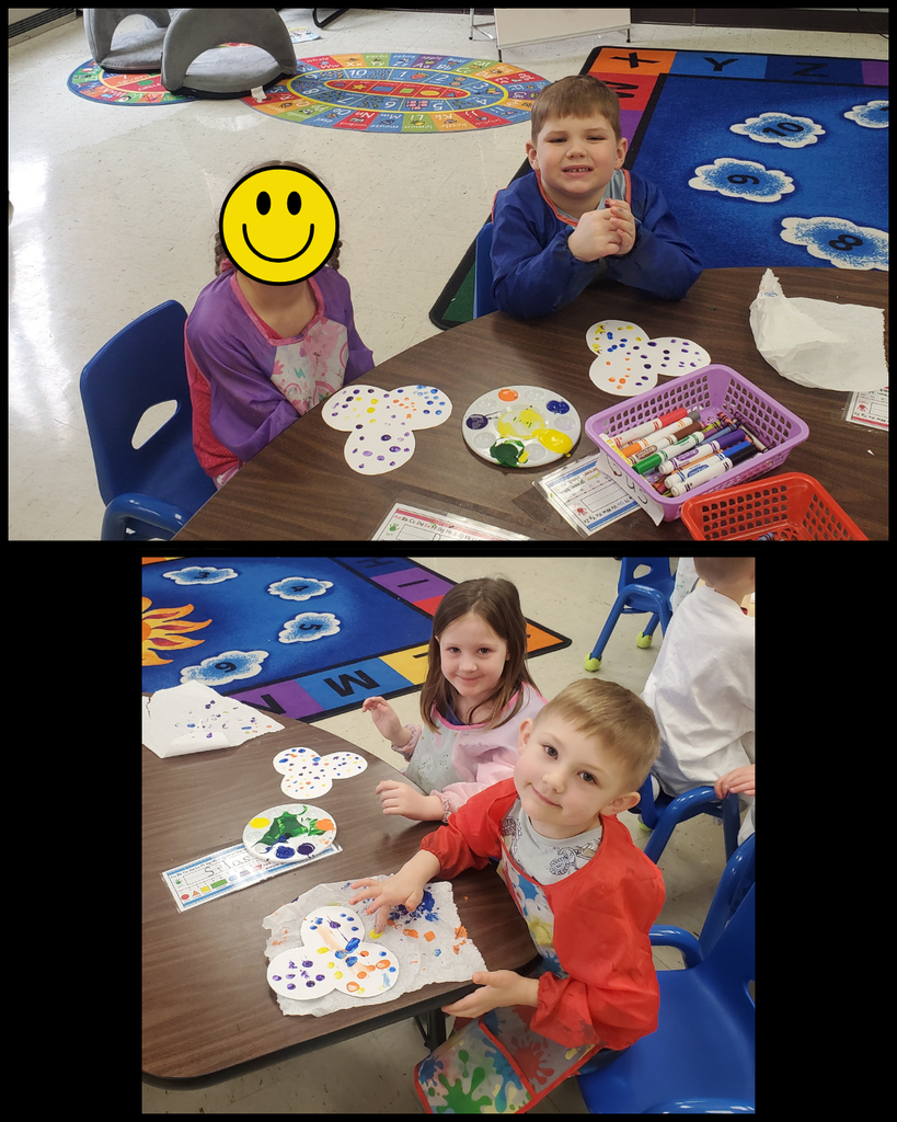 Preschool students making fingerprint flowers