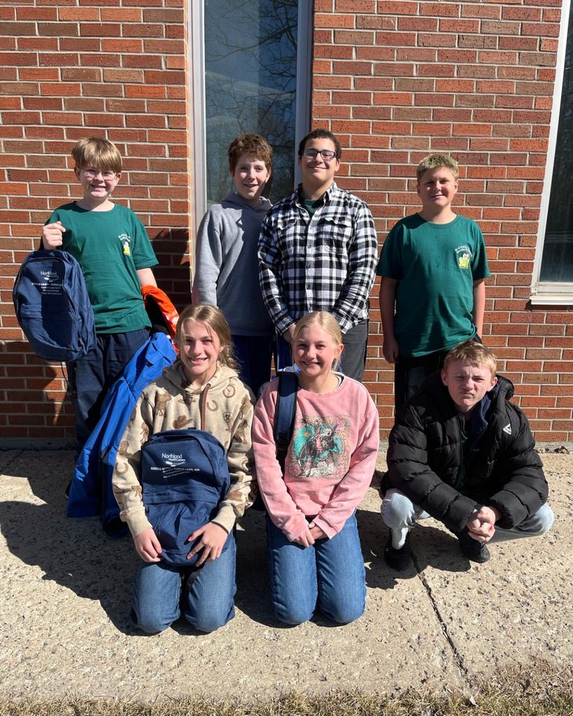 Seven junior high students posing for the camera