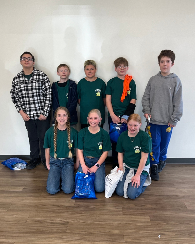 Eight junior high students posing for the camera