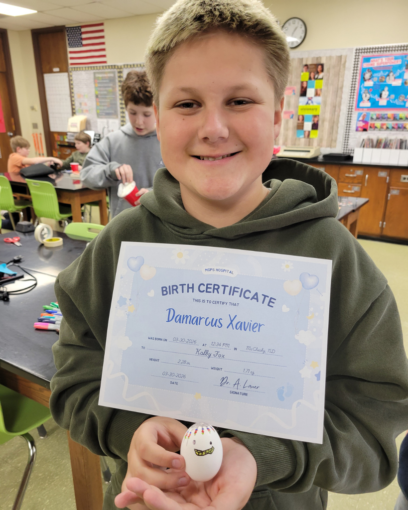 A junior high student holding an egg and a birth certificate