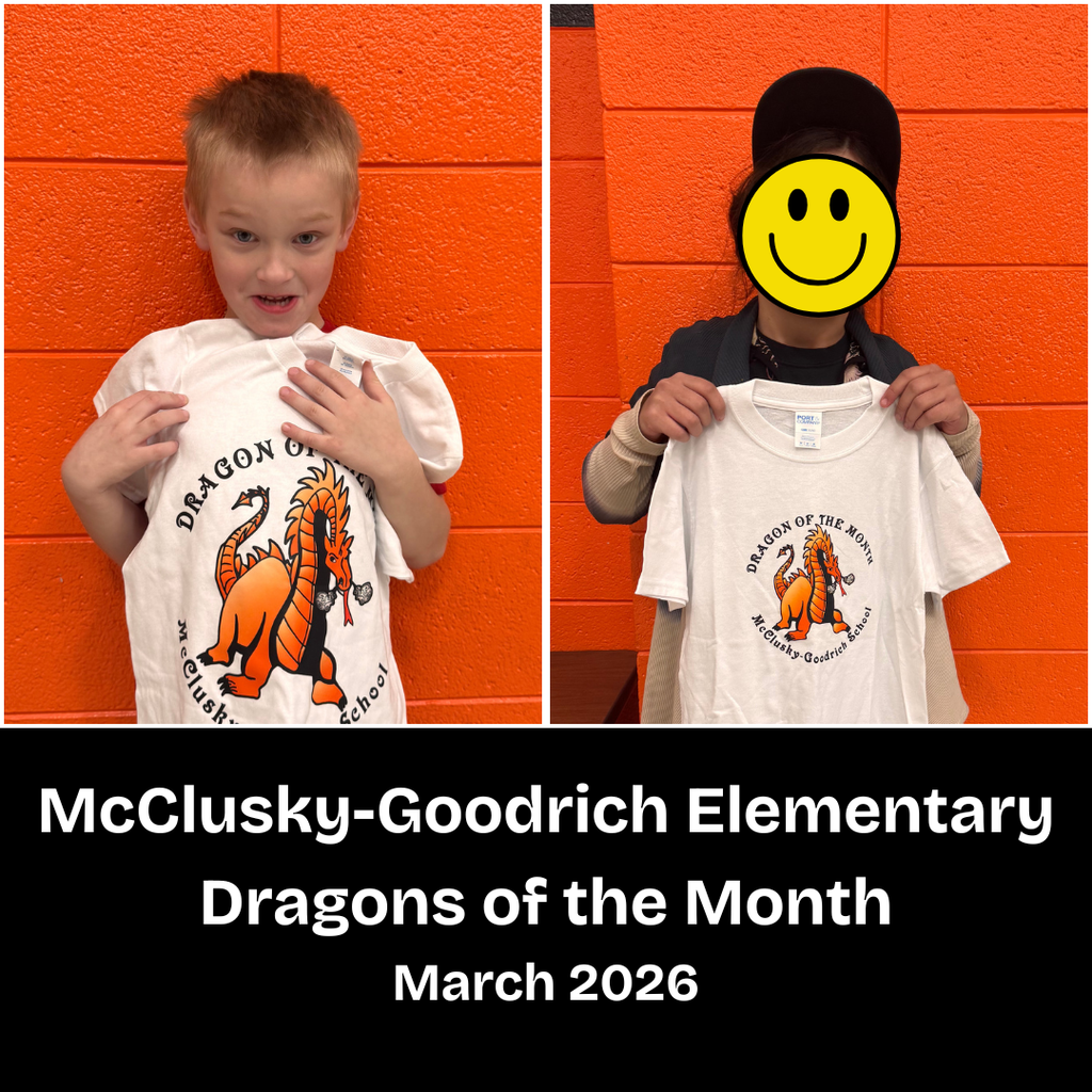 Two elementary students holding Dragon of the Month t-shirts