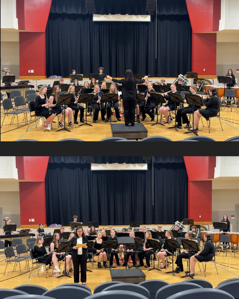 High school students with instruments playing with a director.