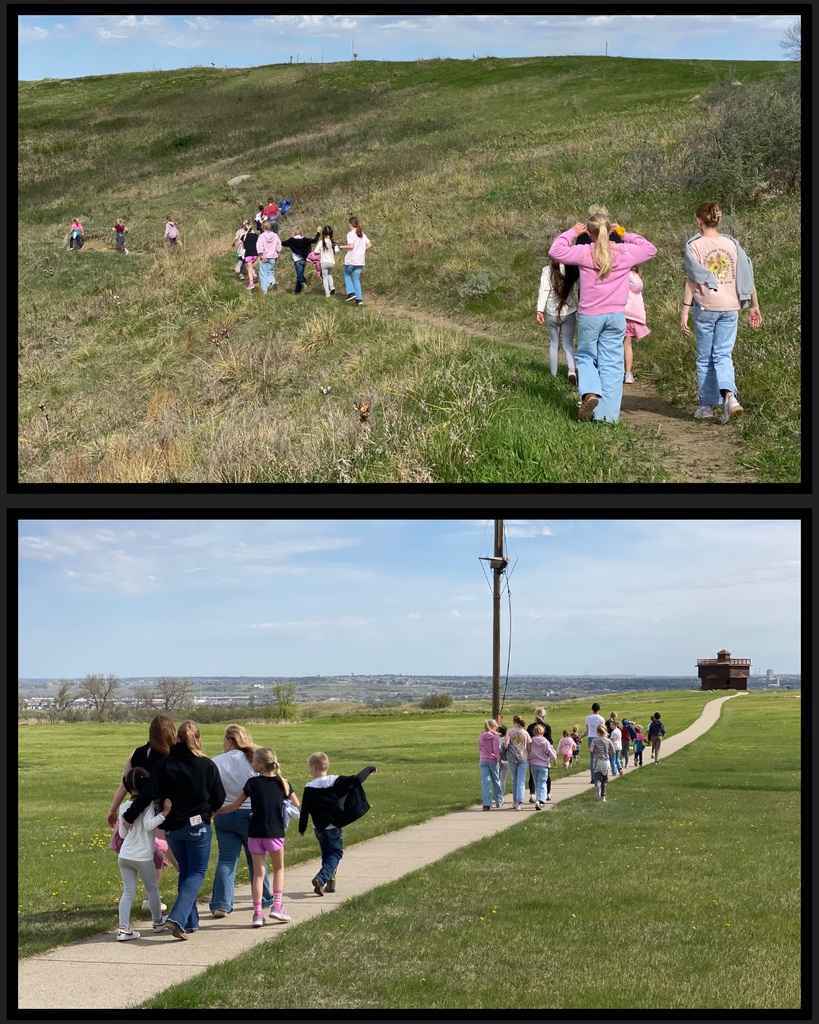Students walking on trails towards blockhouses at Fort Abraham Lincoln State Park