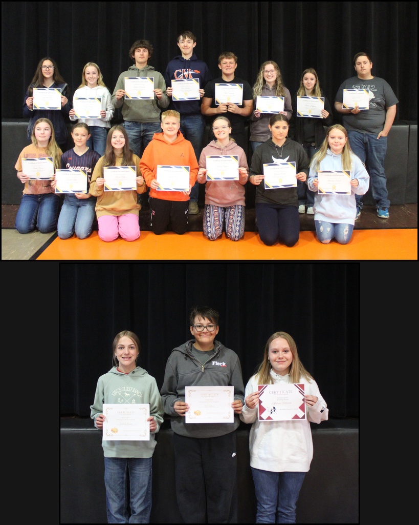 High school students posing with award certificates