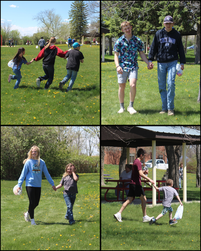 High school and elementary school students holding hands and running in the park