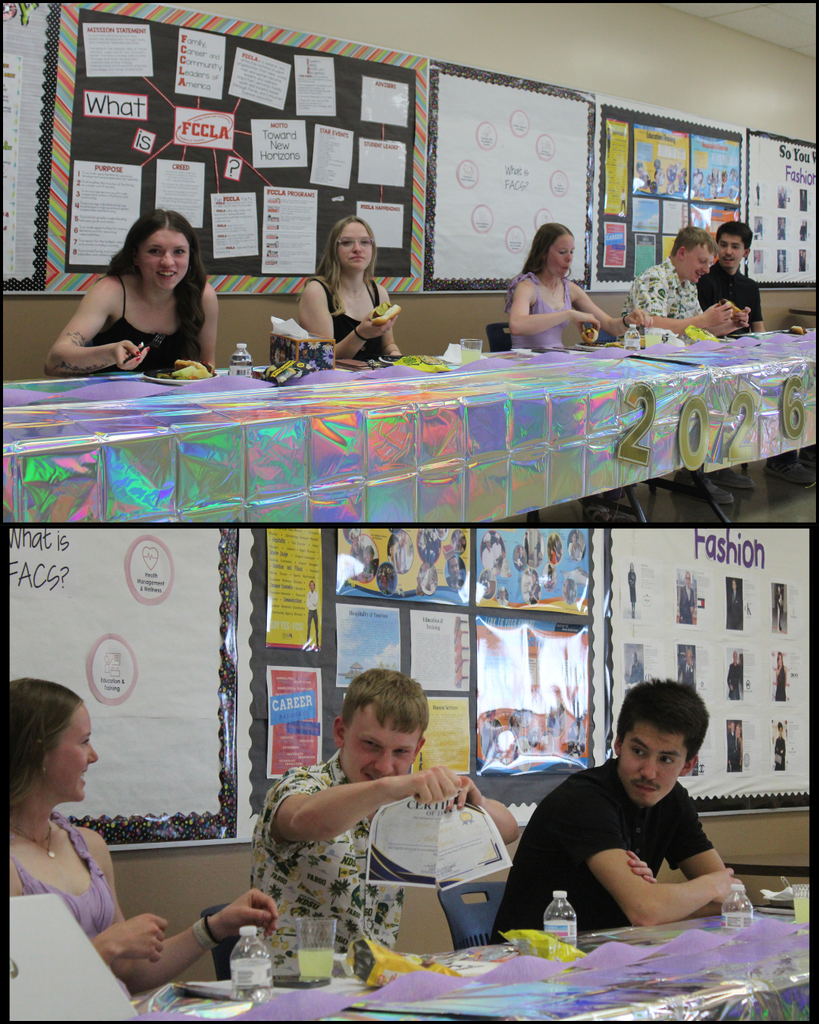 Five high school seniors sitting at a long, decorated table