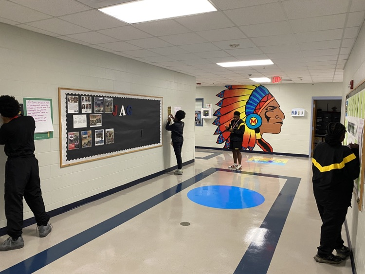 students in hallway working