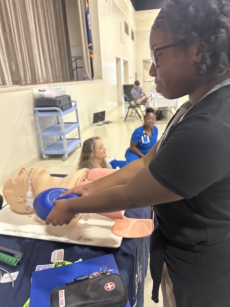 Student giving CPR
