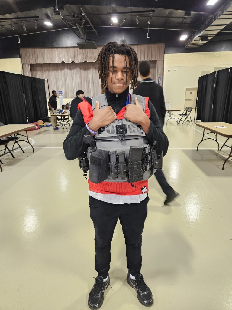 Student wearing combat vest