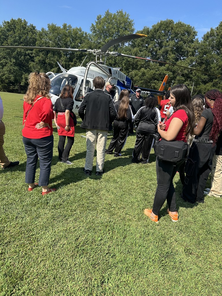 Students looking at helicopter