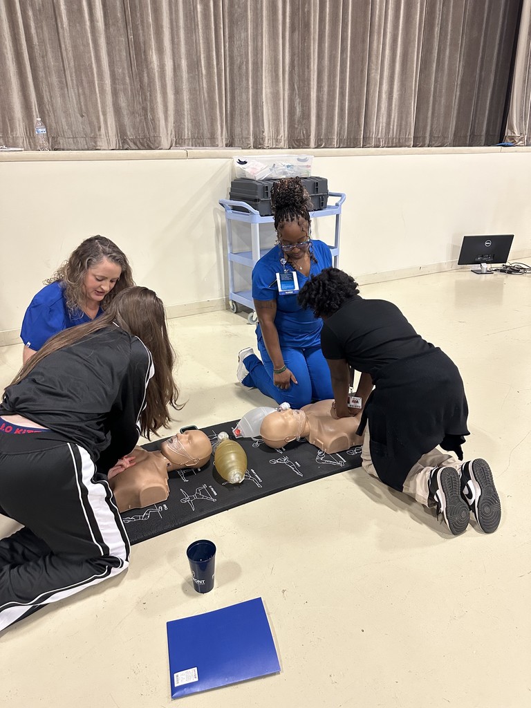 Student giving CPR again