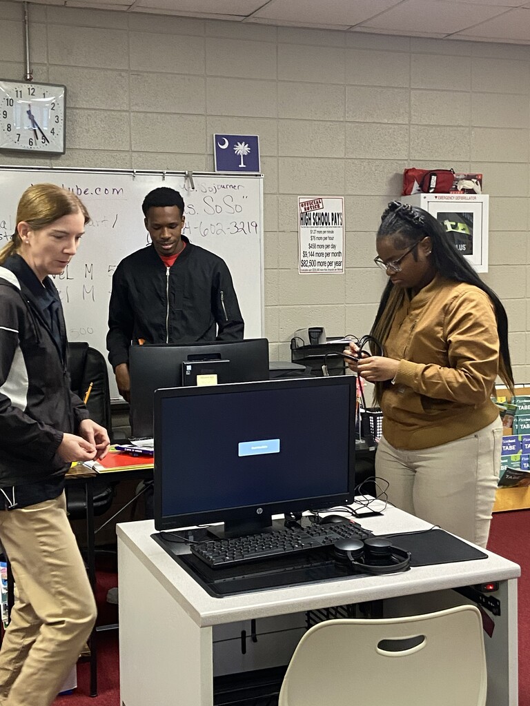 JROTC setting up desktops for adult ed