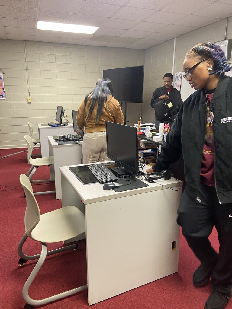 JROTC setting up desktops for adult ed