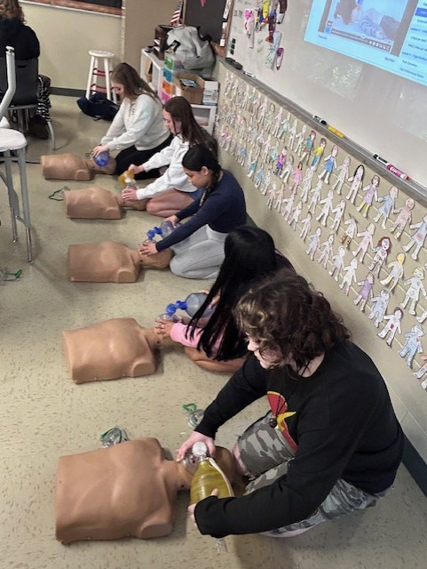 Students are also practicing CPR, building confidence in critical, life-saving techniques.
