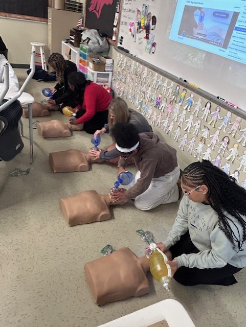 Students are also practicing CPR, building confidence in critical, life-saving techniques.