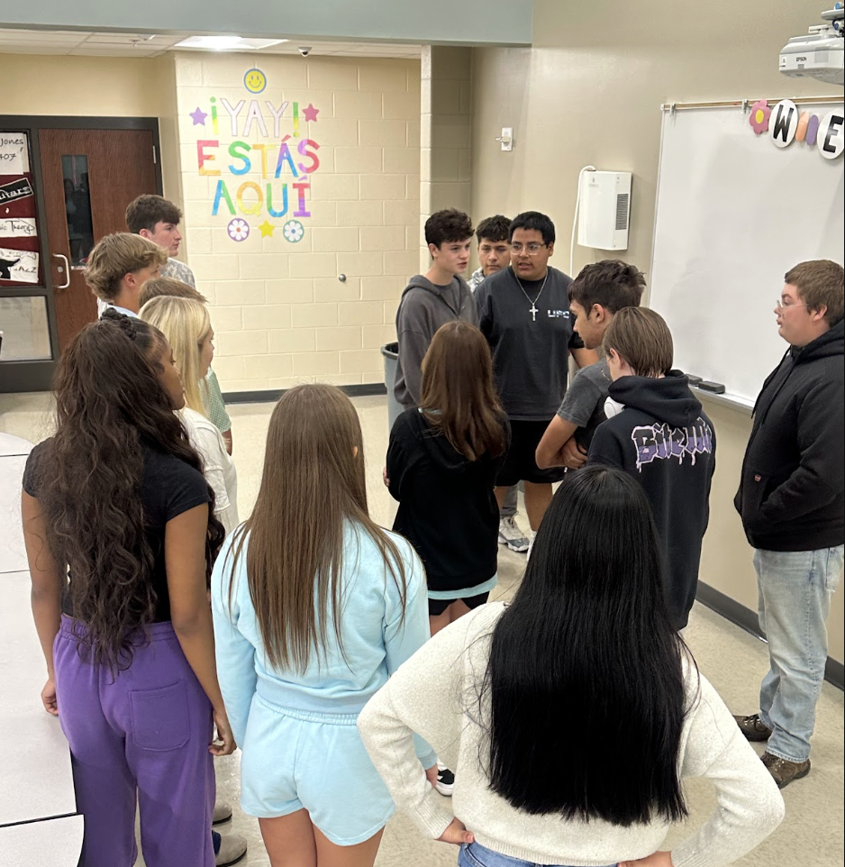 Learning Spanish from A to Z! Mrs. Reside’s Spanish I students have been learning the Spanish alphabet. After practicing the letters and their pronunciation, they took their practice to the next level by spelling out the letters in human form! It’s a fun, hands-on way to reinforce pronunciation, letter recognition, and teamwork while bringing Spanish to life in the classroom. ¡Buen trabajo, Mustangs!