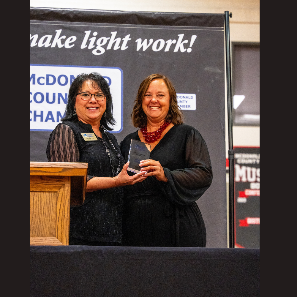 Angie Brewer receives award from Chamber representative