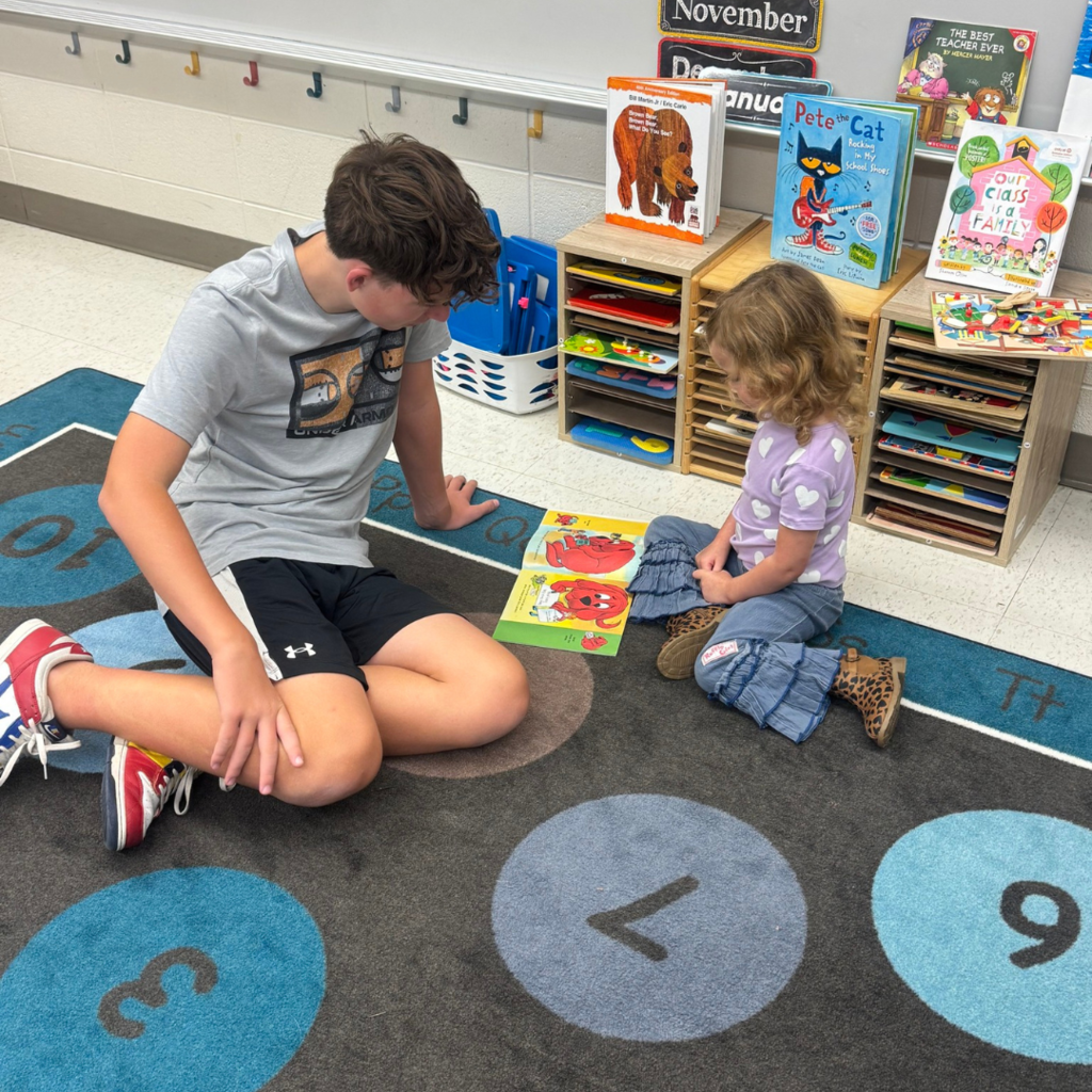 Boy and girl looking at book 